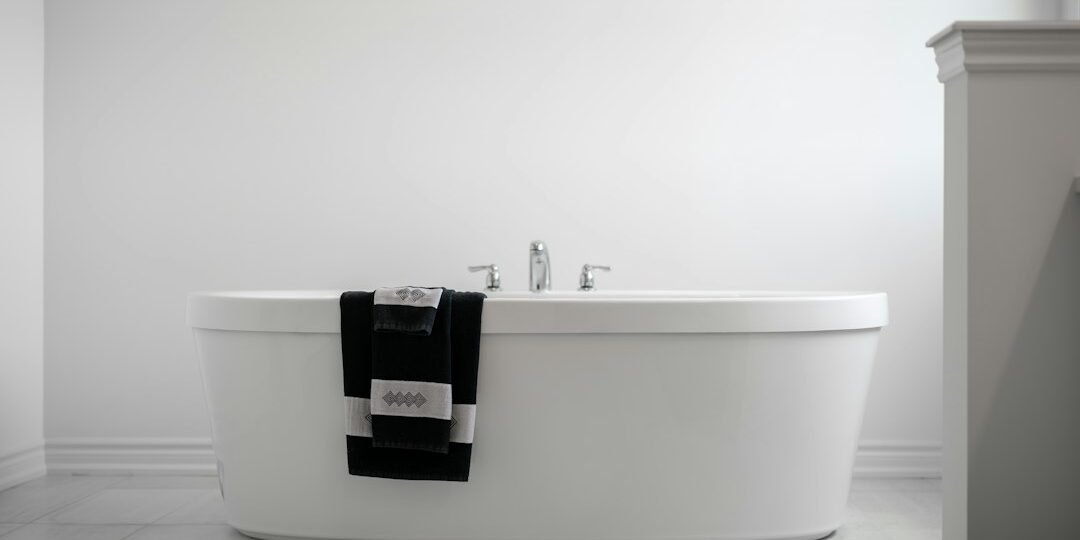 White hotel towels in a modern hospitality bathroom