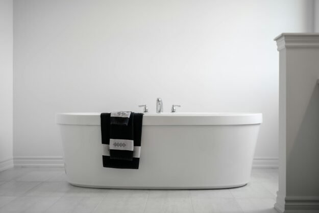 White hotel towels in a modern hospitality bathroom