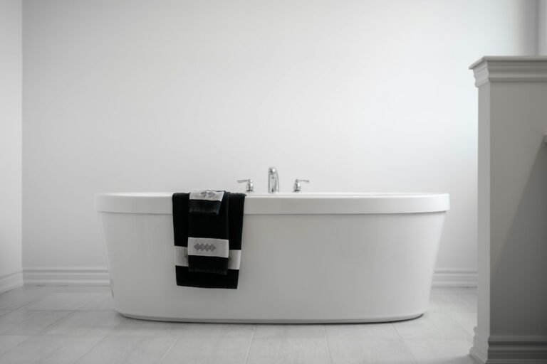 White hotel towels in a modern hospitality bathroom