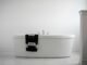 White hotel towels in a modern hospitality bathroom