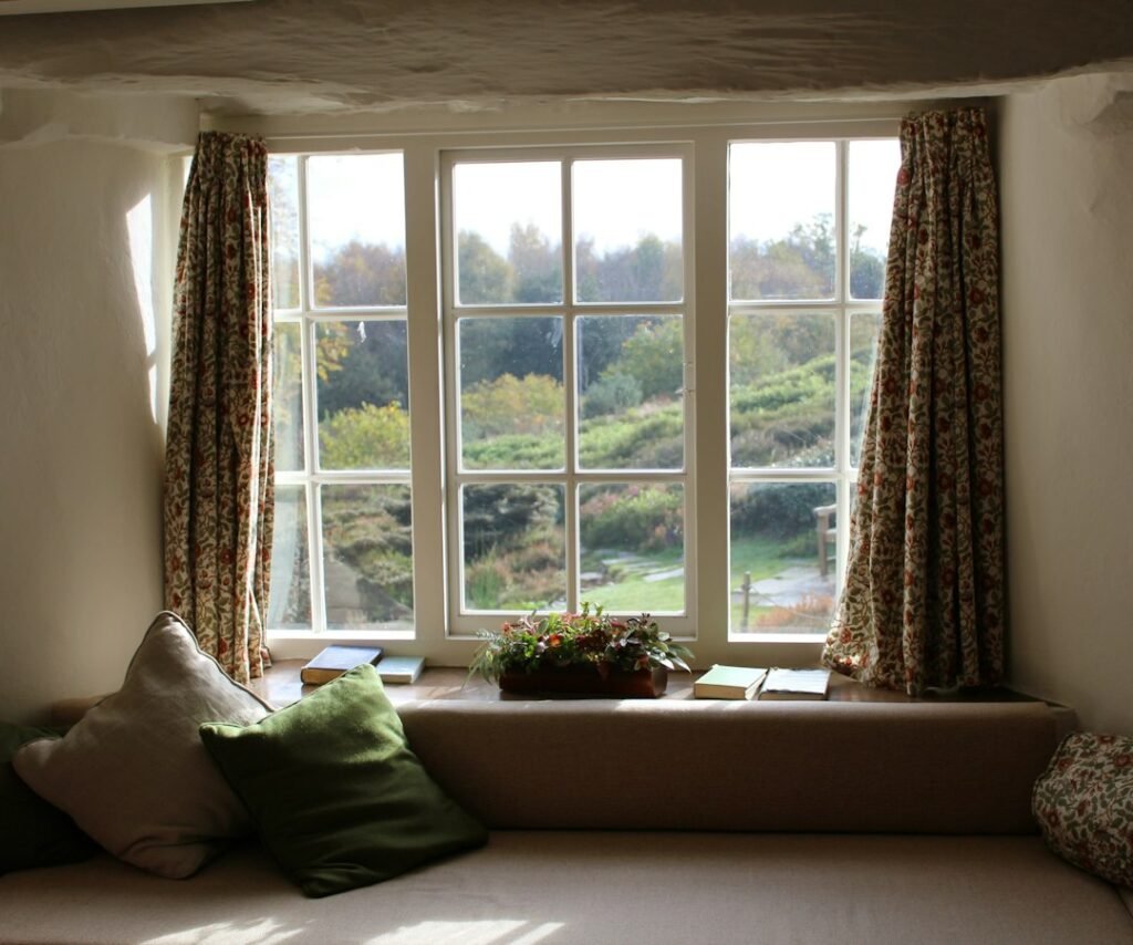 Window framed by full-length drapes — representative interior photograph