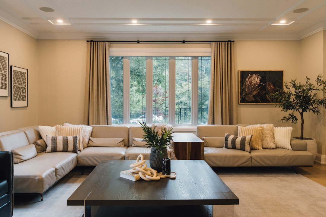 Neutral curtains framing a living room window — representative interior photograph