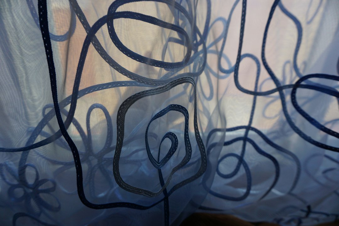 Patterned sheer curtain design — representative fabric styling photograph