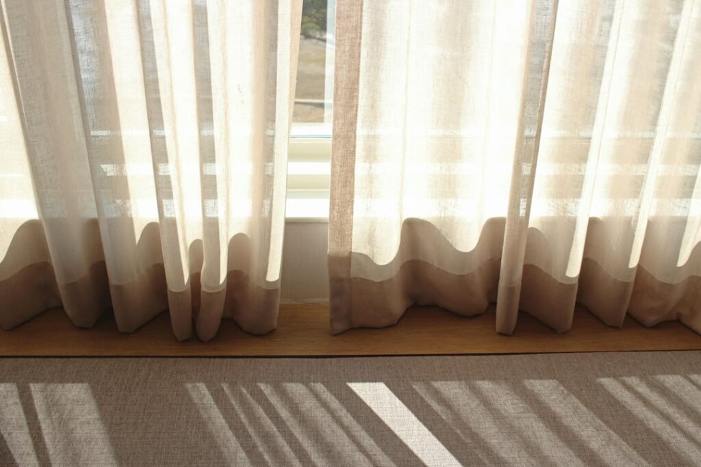White sheer window curtains in daylight — representative interior photograph