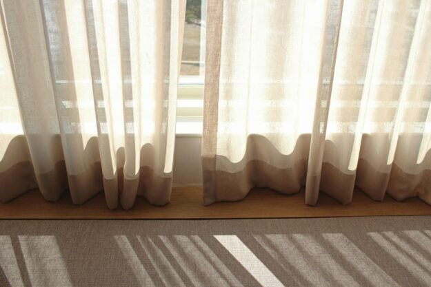 White sheer window curtains in daylight — representative interior photograph