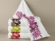 White towels with colourful floral embroidery